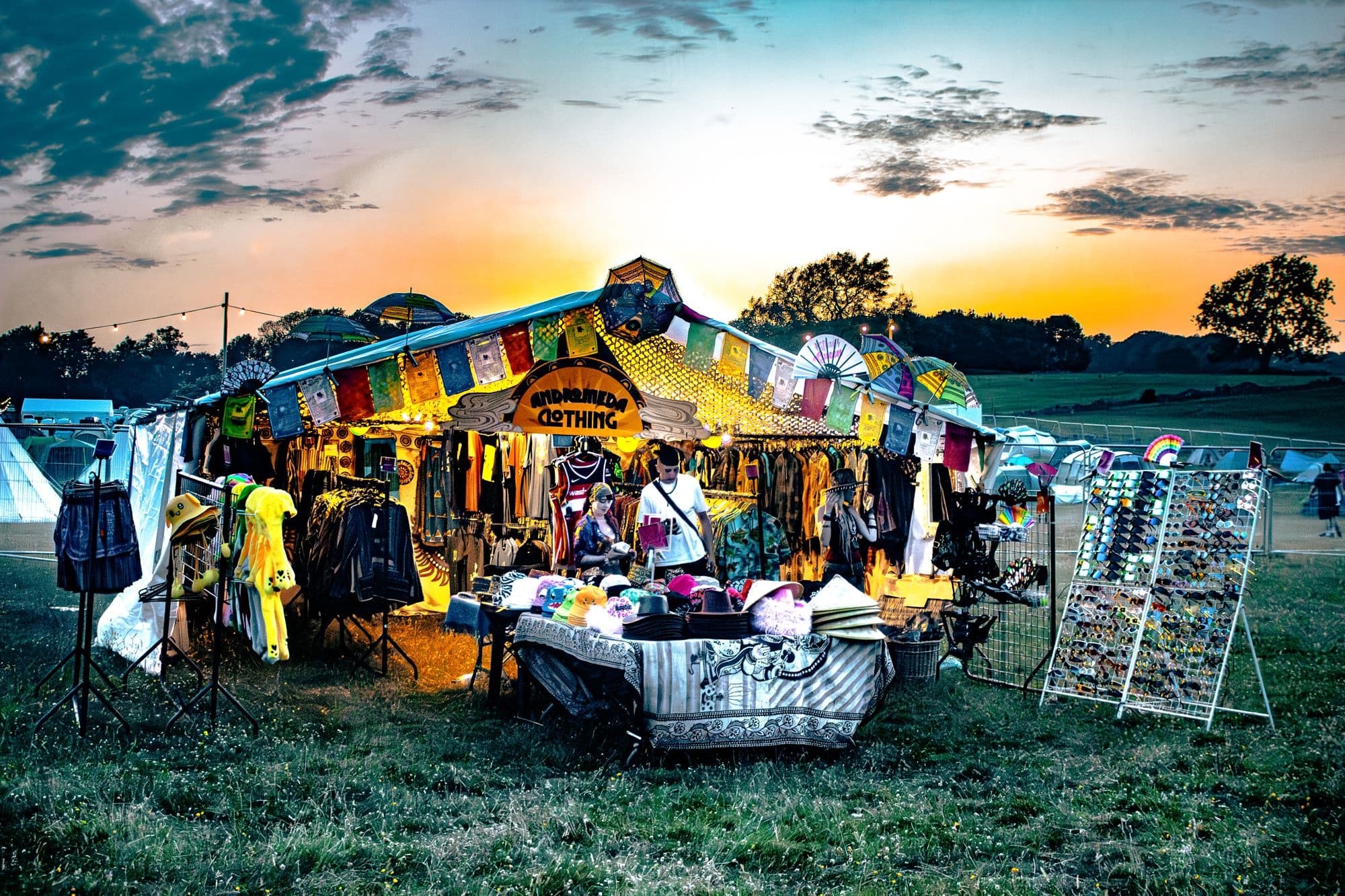 Clothing stall trading at sunset at Rosa Festival