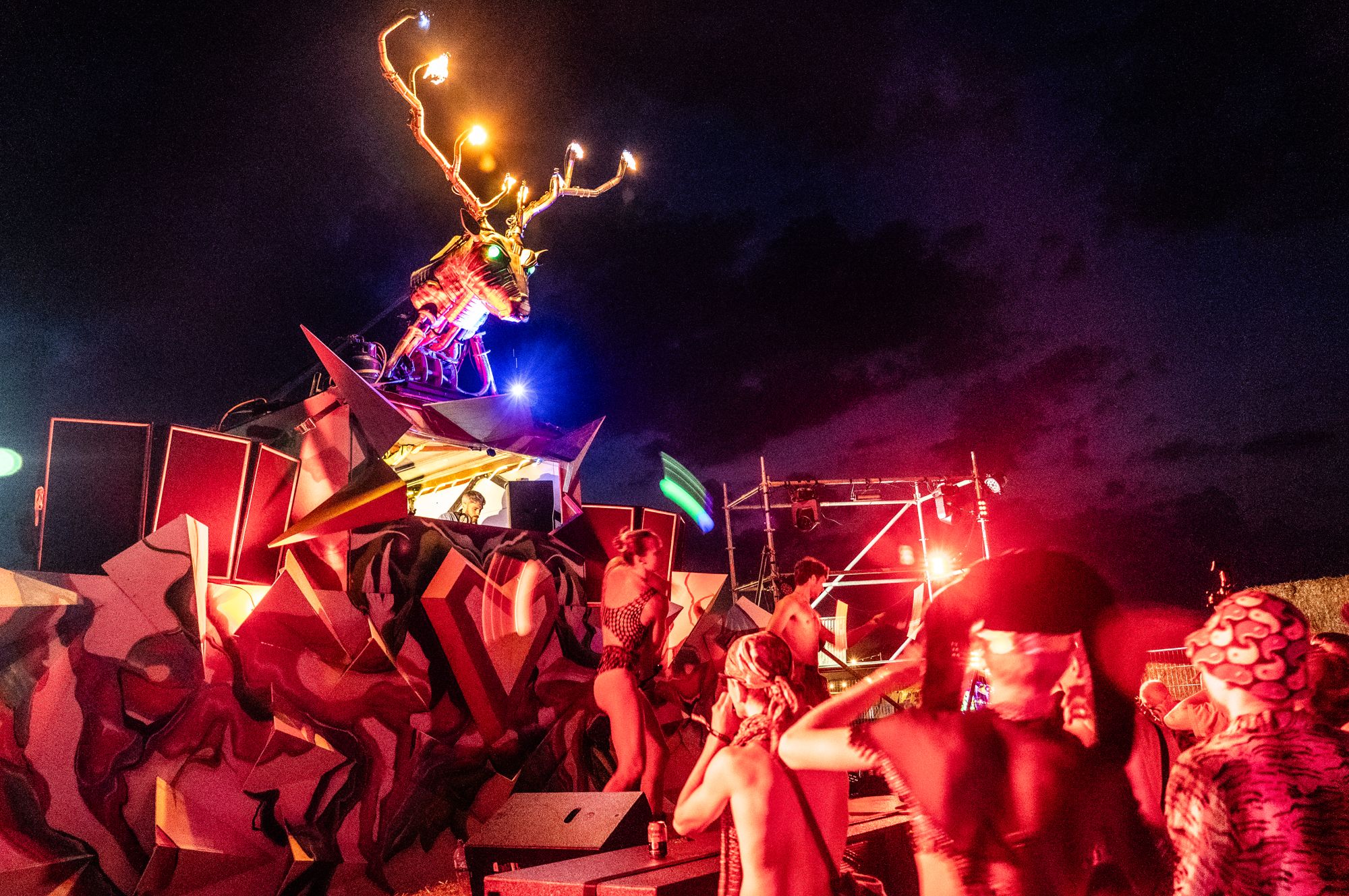 The deer stage glowing against the night sky